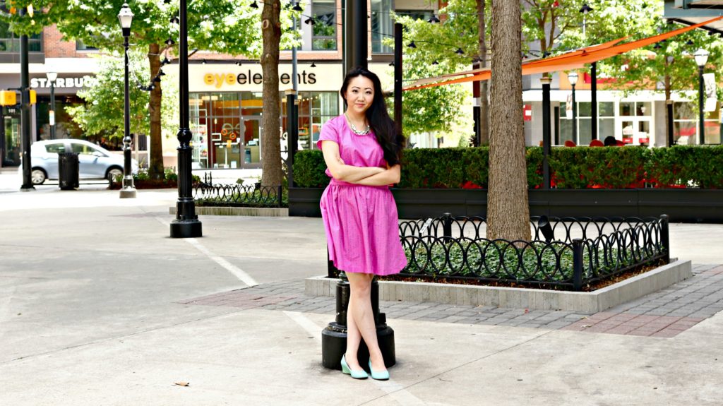 Jennifer Pink Outfit Wide Shot Street Pole Arms Crossed EDITED