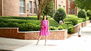 Jennifer Pink Outfit Glittery Fuschia Clutch Purse Brick Wall Full Shot EDITED